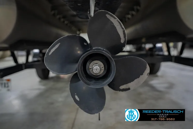 Slide: The Image of Propeller of a 2015 Bennington 2350 RSR boat, displayed in a showroom. - 56