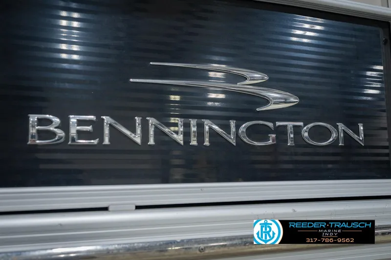Slide: The Image of Bennington 2350 RSR 2015 model logo on a boat with dealership contact information. - 59