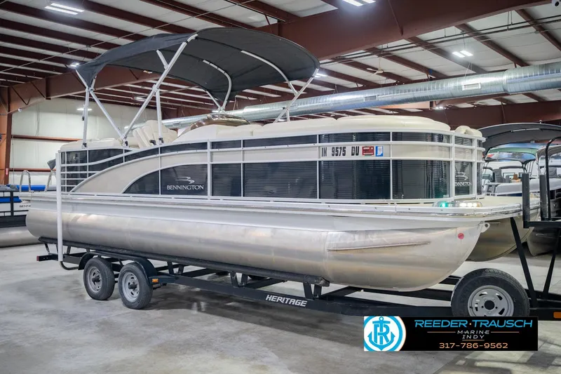 Slide: The Image of 2015 Bennington 2350 RSR pontoon boat on trailer in indoor showroom. - 6