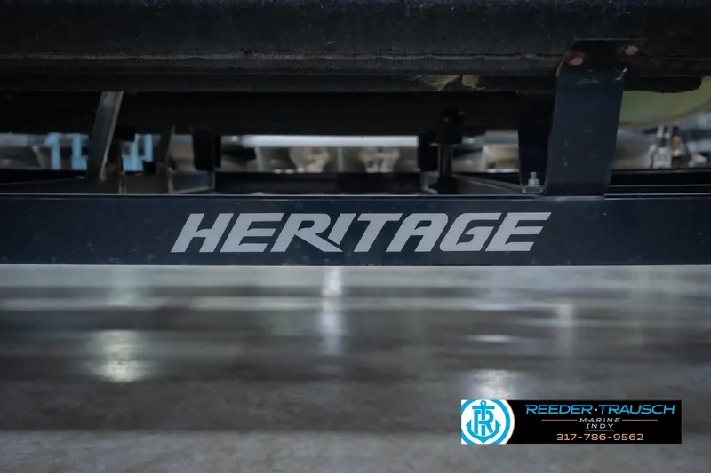 Slide: The Image of Trailer frame with "HERITAGE" branding, associated with a 2015 Bennington 2350 RSR boat. - 62