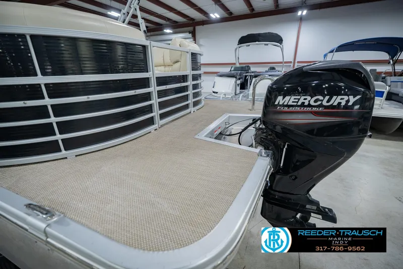 Slide: The Image of 2015 Bennington 2350 RSR pontoon boat with Mercury FourStroke engine in showroom. - 63