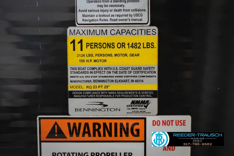 Slide: The Image of 2015 Bennington 2350 RSR capacity label, 11 persons or 1482 lbs, safety compliance. - 65