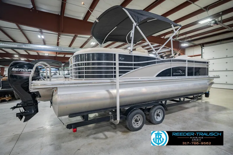 Slide: The Image of 2015 Bennington 2350 RSR pontoon boat with Mercury engine in indoor storage facility. - 8