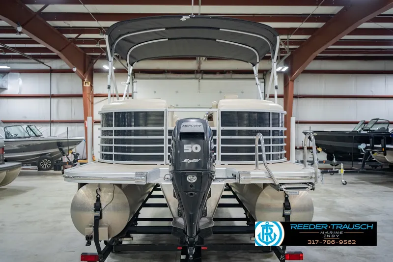 Slide: The Image of 2015 Bennington 2350 RSR pontoon boat with Mercury 50 engine in indoor showroom. - 9