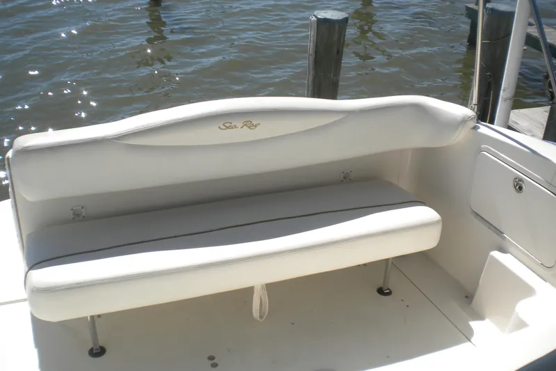 Slide: The Image of 2002 Sea Ray Sundancer 280 boat seat, white upholstery, dockside view. - 16