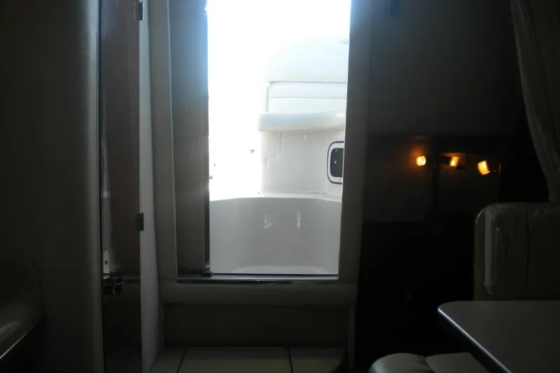 Slide: The Image of Interior view of 2002 Sea Ray Sundancer 280 yacht, showing cabin and doorway. - 34
