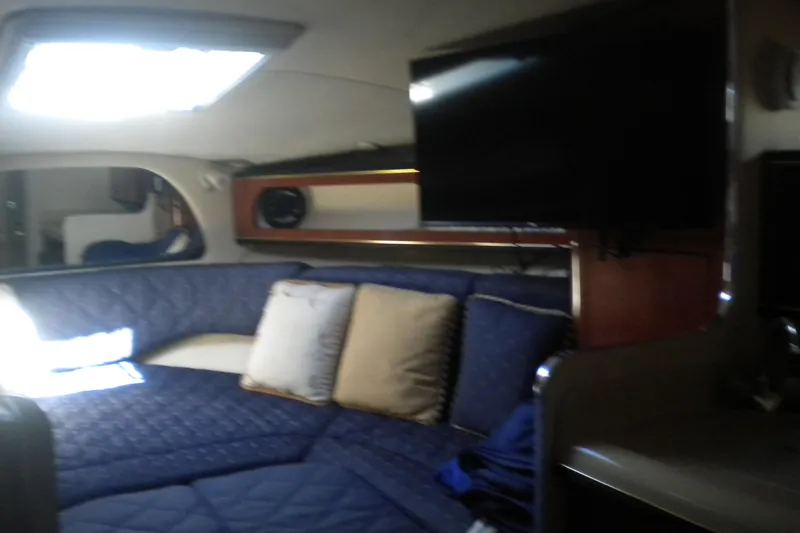 Slide: The Image of Interior of 2002 Sea Ray Sundancer 280 with cozy seating and mounted TV. - 44