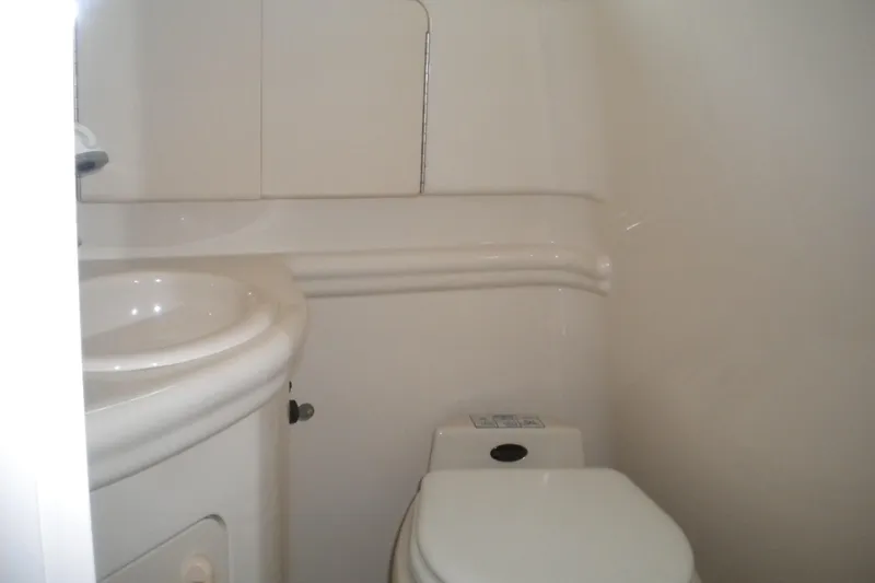 Slide: The Image of 2002 Sea Ray Sundancer 280 bathroom interior with sink and toilet. - 47