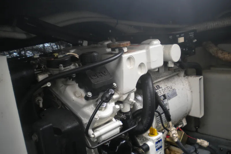 Slide: The Image of Engine compartment of a 2002 Sea Ray Sundancer 280 boat, featuring detailed mechanical components. - 51