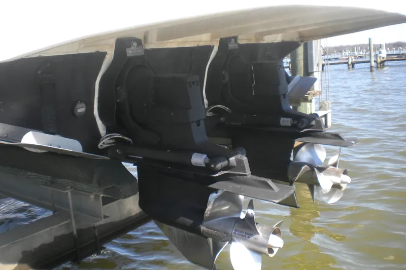 Slide: The Image of 2002 Sea Ray Sundancer 280 boat propellers and stern drives in marina. - 59
