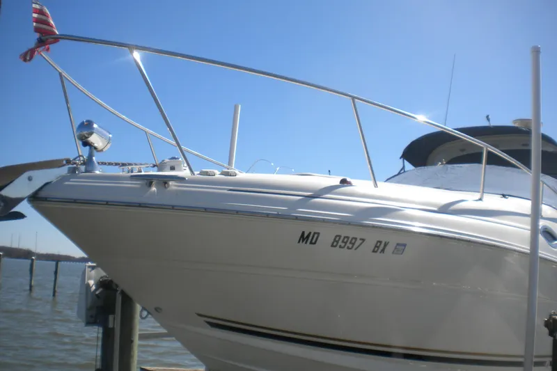 Slide: The Image of 2002 Sea Ray Sundancer 280 boat docked under clear blue sky. - 8