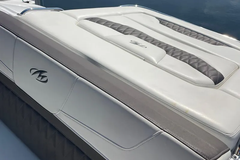 Slide: The Image of 2018 Monterey 328 Super Sport boat with sleek white and gray upholstery design. - 17