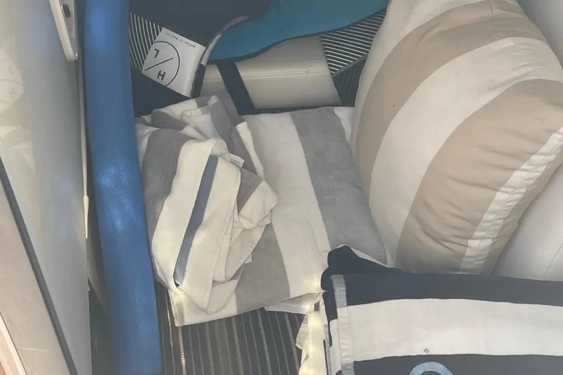 Slide: The Image of Interior of 2018 Monterey 328 Super Sport with striped cushions and pillows. - 21