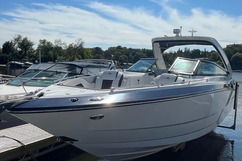 Slide: The Image of 2018 Monterey 328 Super Sport boat docked on a sunny day. - 29