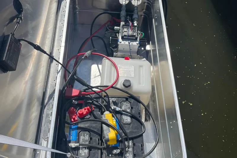 Slide: The Image of Battery compartment of a 2018 Monterey 328 Super Sport boat with wiring and components. - 30