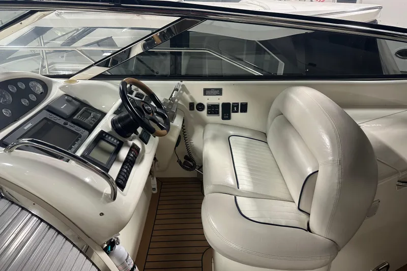 Slide: The Image of 1997 Sunseeker Camargue 51 yacht cockpit with leather seating and modern controls. - 11