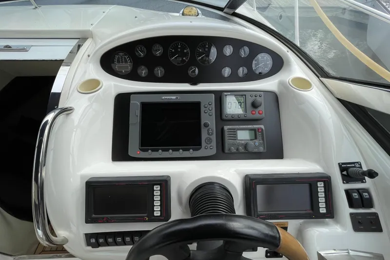 Slide: The Image of Control panel of a 1997 Sunseeker Camargue 51 yacht with navigation instruments. - 12