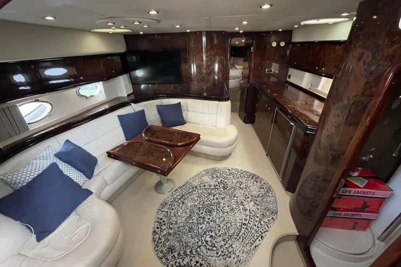 Slide: The Image of Luxurious interior of 1997 Sunseeker Camargue 51 yacht with elegant seating and wood finishes. - 13