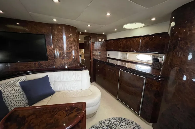 Slide: The Image of Luxurious interior of a 1997 Sunseeker Camargue 51 yacht with elegant wood finishes. - 14