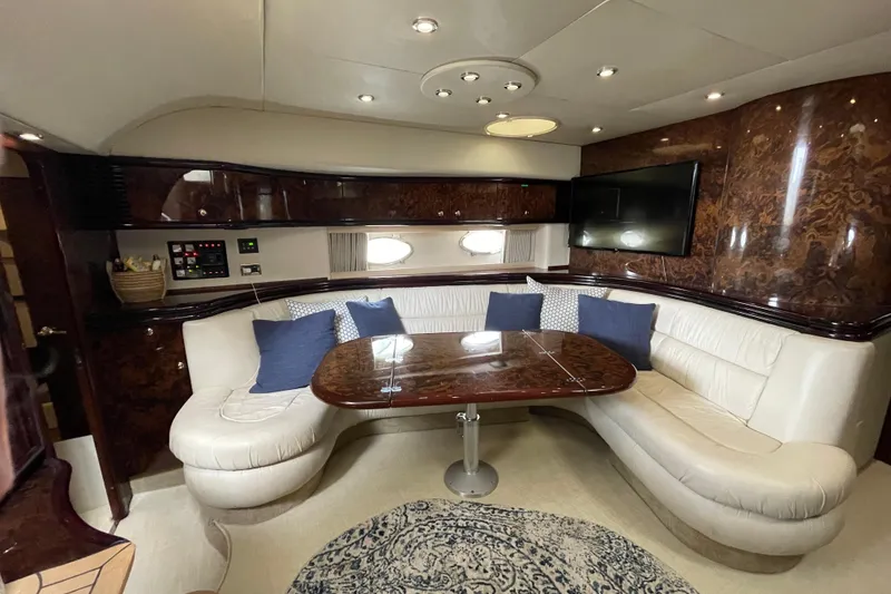 Slide: The Image of Luxurious interior of 1997 Sunseeker Camargue 51 yacht with elegant seating and wood finishes. - 15