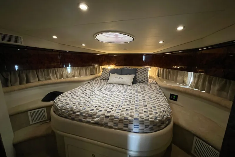 Slide: The Image of Luxurious bedroom interior of 1997 Sunseeker Camargue 51 yacht with elegant lighting. - 17