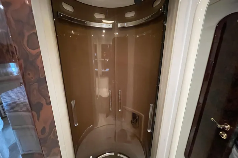 Slide: The Image of Shower area inside a 1997 Sunseeker Camargue 51 yacht, featuring sleek design and modern fixtures. - 19