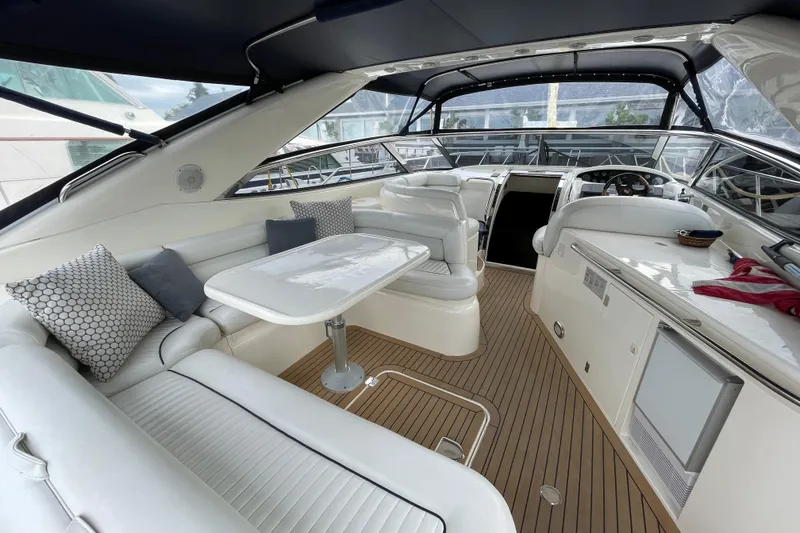Slide: The Image of Luxurious interior of a 1997 Sunseeker Camargue 51 yacht with elegant seating and modern amenities. - 2