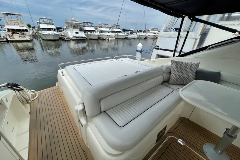 Slide: The Image of Luxurious 1997 Sunseeker Camargue 51 yacht interior with marina view. - 5