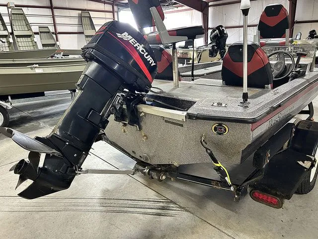 Slide: The Image of Basstream 1550 boat with Mercury engine, 2021 model, in a storage facility. - 10