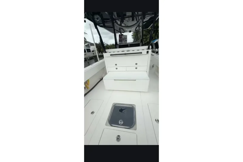 Slide: The Image of 2020 Contender 39 ST boat interior with storage compartments and seating. - 12