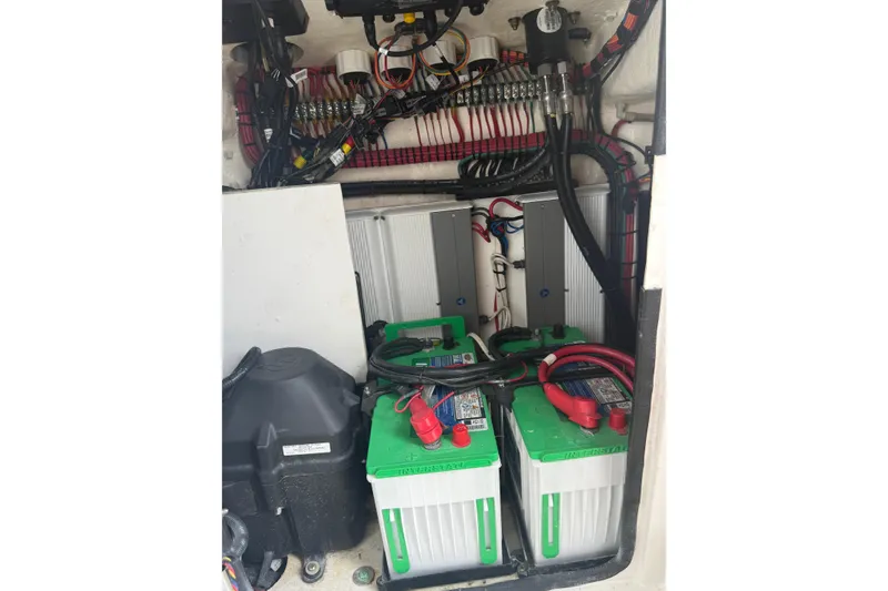 Slide: The Image of 2020 Contender 39 ST boat battery compartment with wiring and components. - 20