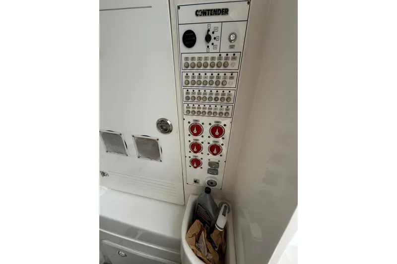 Slide: The Image of Control panel of 2020 Contender 39 ST boat with switches and dials. - 21