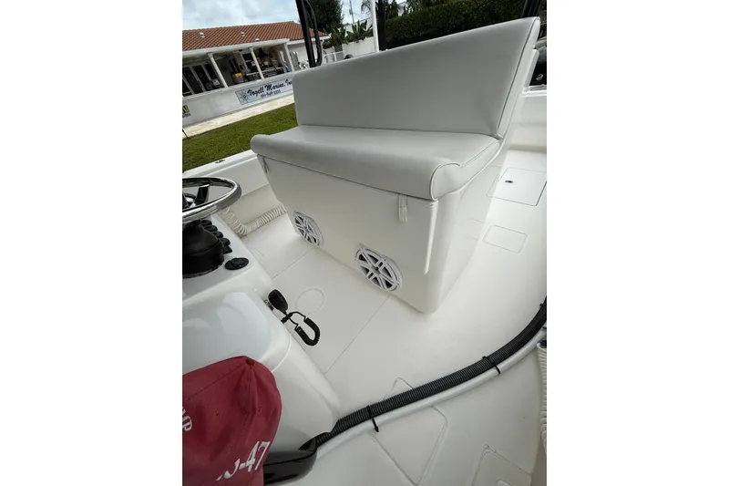 Slide: The Image of 2020 Contender 39 ST boat interior with cushioned seating and speakers. - 22