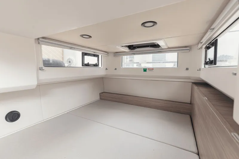 Slide: The Image of Interior of a modern cabin with white walls and wood accents. - 3