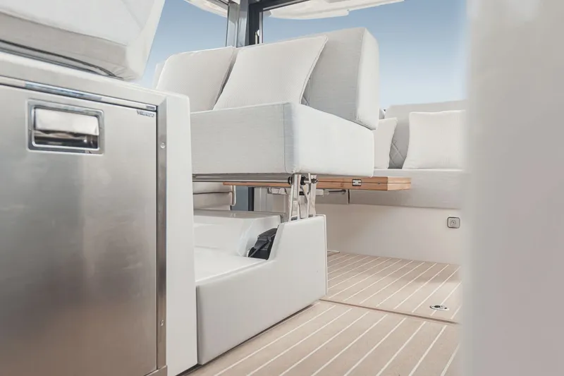 Slide: The Image of Interior of a 2027 Saxdor 400 GTO with sleek seating and wooden flooring. - 22