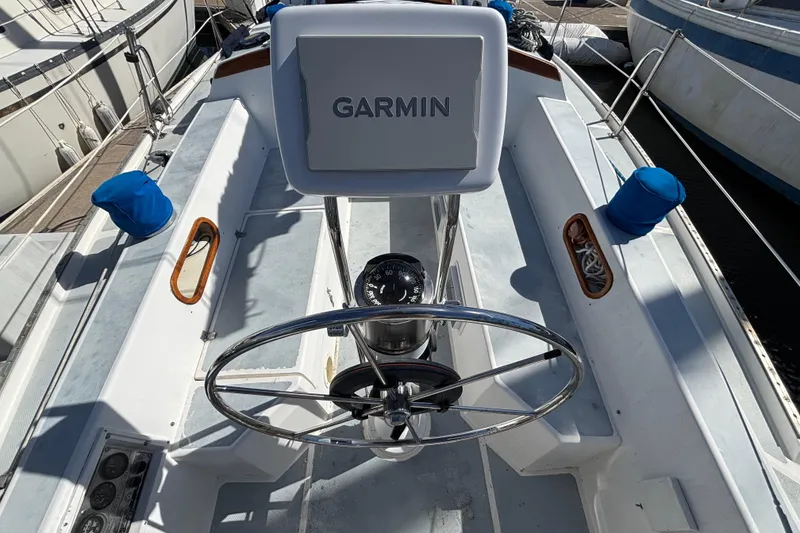 Slide: The Image of Cockpit of 1988 Catalina 34 sailboat with Garmin navigation system and steering wheel. - 31
