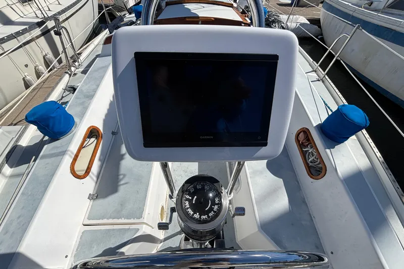 Slide: The Image of Cockpit of 1988 Catalina 34 sailboat with Garmin navigation display and compass. - 32