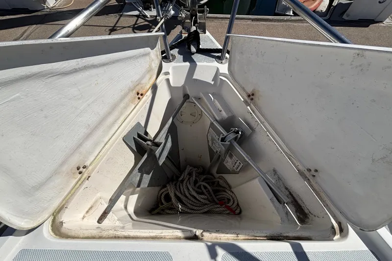Slide: The Image of Anchor locker of 1988 Catalina 34 sailboat with rope and anchor inside. - 38
