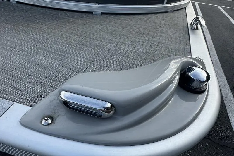 Slide: The Image of 2023 Bennington 22 SX Swingback boat deck with sleek design and chrome accents. - 17