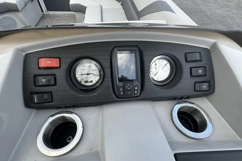 Slide: The Image of Dashboard of 2023 Bennington 22 SX Swingback boat with gauges and controls. - 19