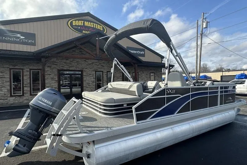 Slide: The Image of 2023 Bennington 22 SX Swingback pontoon boat displayed at Boat Masters dealership. - 8