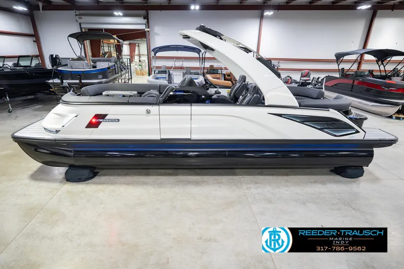 The Image of 2026 Bennington QX 25 QXFBA pontoon boat in showroom, side view. - 0