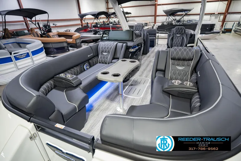 Slide: The Image of 2026 Bennington QX 25 QXFBA pontoon boat interior with luxurious seating and modern design. - 12