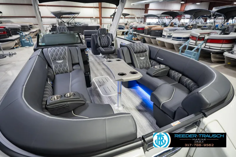 Slide: The Image of Luxurious 2026 Bennington QX 25 QXFBA pontoon boat interior with plush seating and modern design. - 13