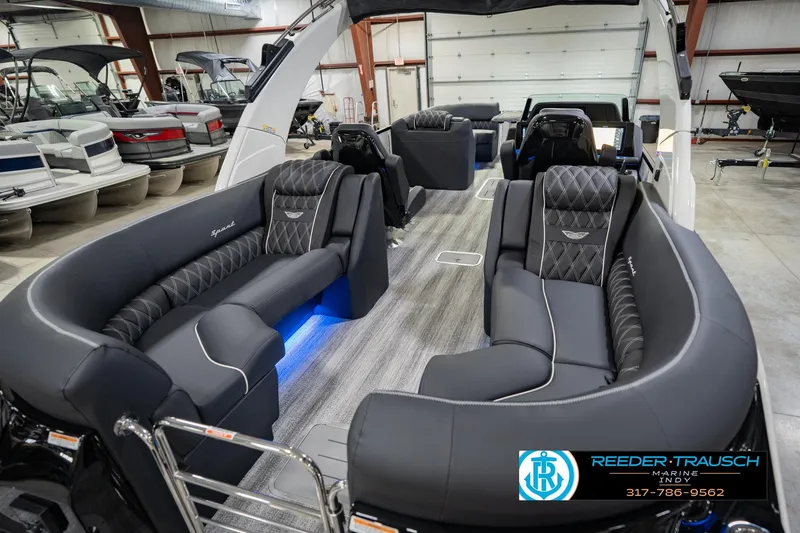 Slide: The Image of 2026 Bennington QX 25 QXFBA luxury pontoon boat interior with plush seating and modern design. - 14