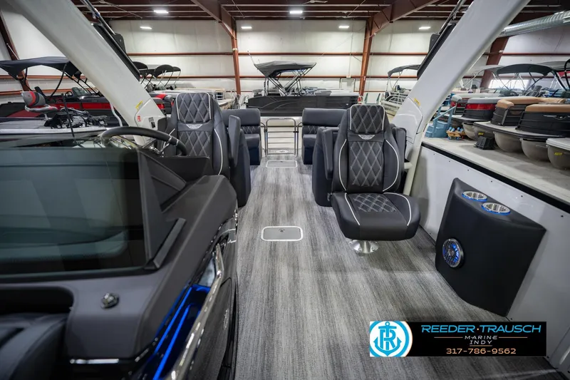 Slide: The Image of Luxurious interior of 2026 Bennington QX 25 QXFBA pontoon boat in showroom. - 17