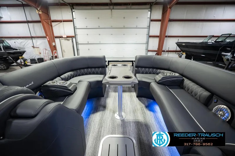 Slide: The Image of Luxurious interior of 2026 Bennington QX 25 QXFBA pontoon boat with plush seating. - 21
