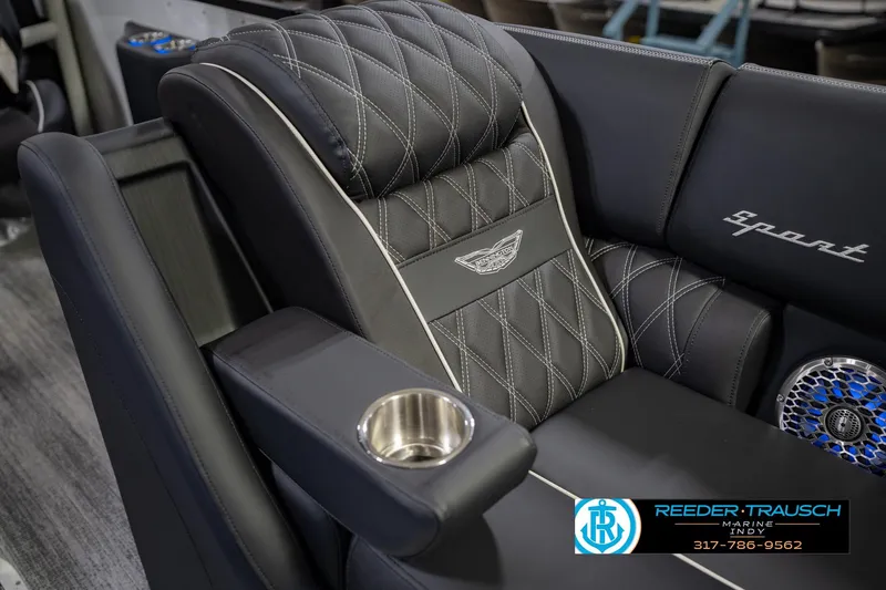 Slide: The Image of Luxurious seating in the 2026 Bennington QX 25 QXFBA boat with cup holder and speaker. - 25
