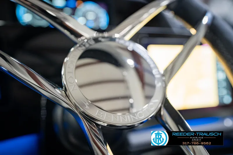 Slide: The Image of Close-up of 2026 Bennington QX 25 QXFBA steering wheel with chrome details. - 30