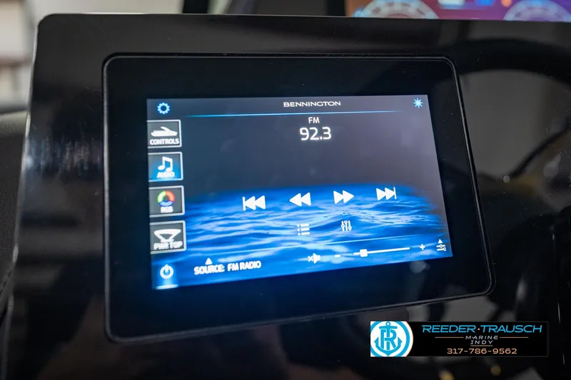 Slide: The Image of Touchscreen display in 2026 Bennington QX 25 QXFBA showing FM radio controls. - 31